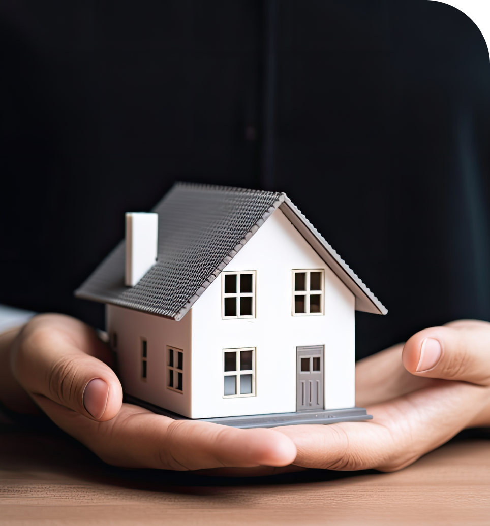 A model house being held by a person