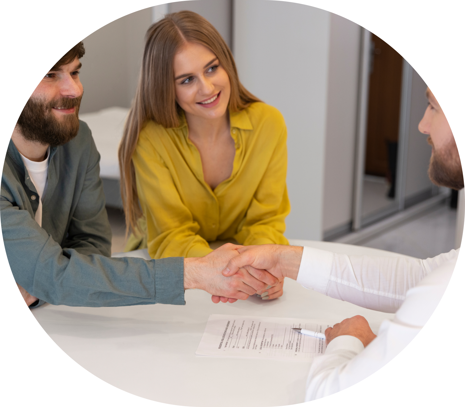 Male real estate agent showing a house to a couple considering purchasing.